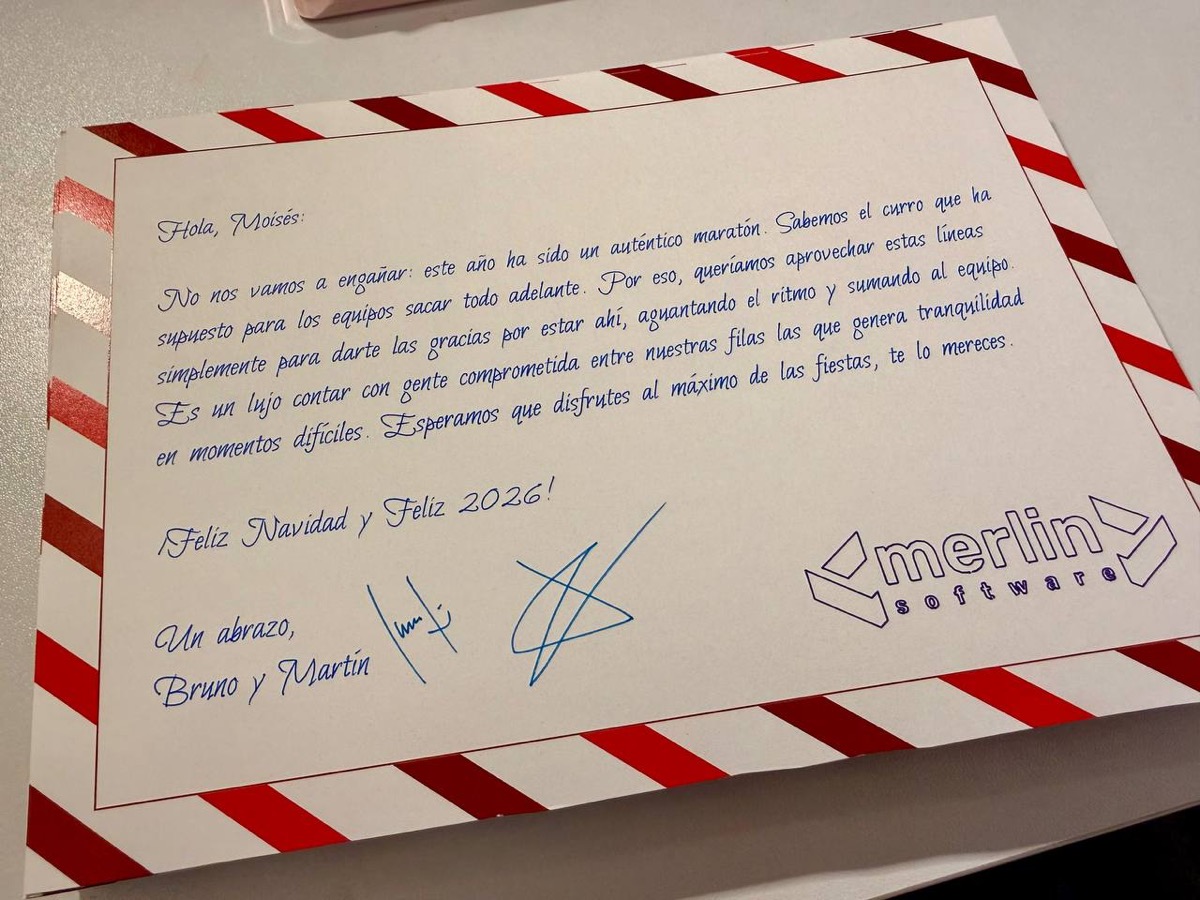 Close-up of a Christmas card: a personalized letter in calligraphic font with the company's logo, all drawn by the plotter.