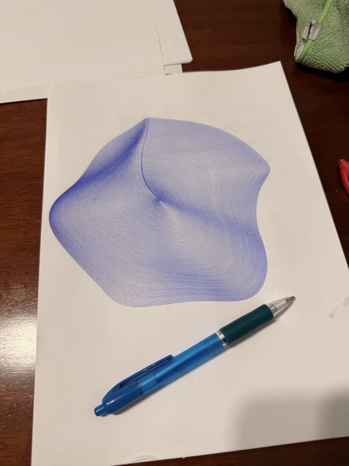 Detailed city map plotted on the iDraw, every street and building outline drawn in black ink.