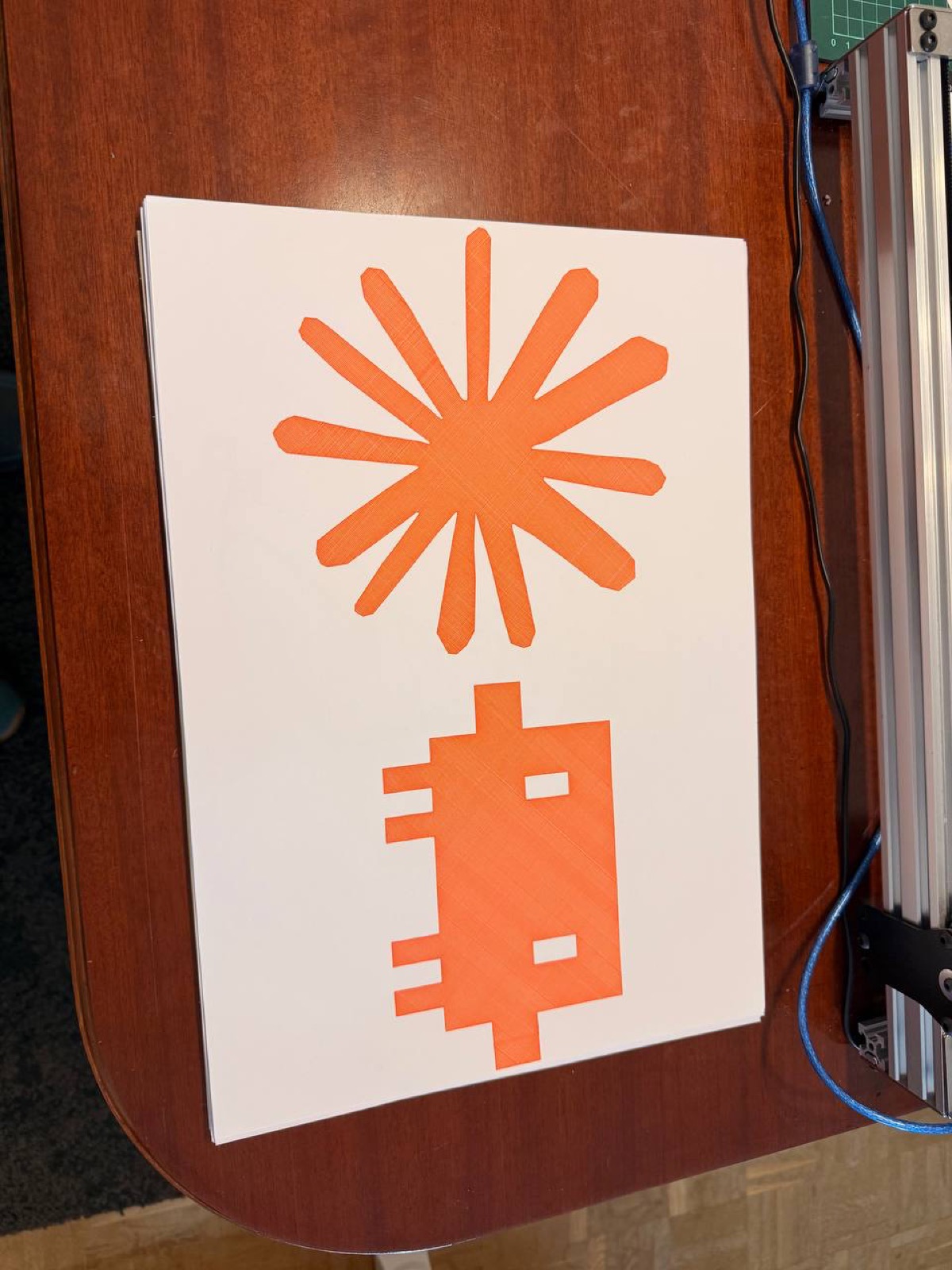 Cross-hatched logos drawn in orange marker.